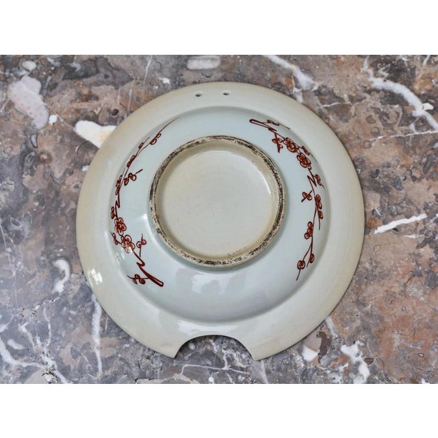Hand-painted Japanese Imari porcelain plate, originally intended as a shaving bowl. The characteristic cutout on the edge...