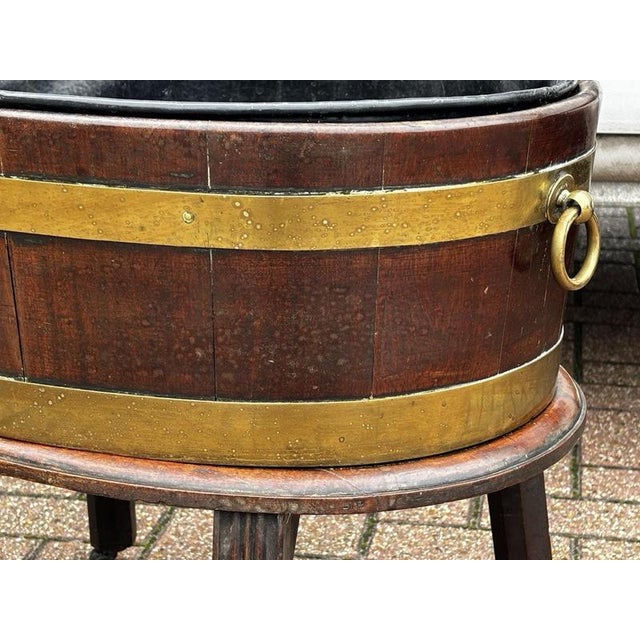 Georgian Mahogany Wine Cooler with Handles For Transportation, with Fittings. Lifts off its base which has brass castors....