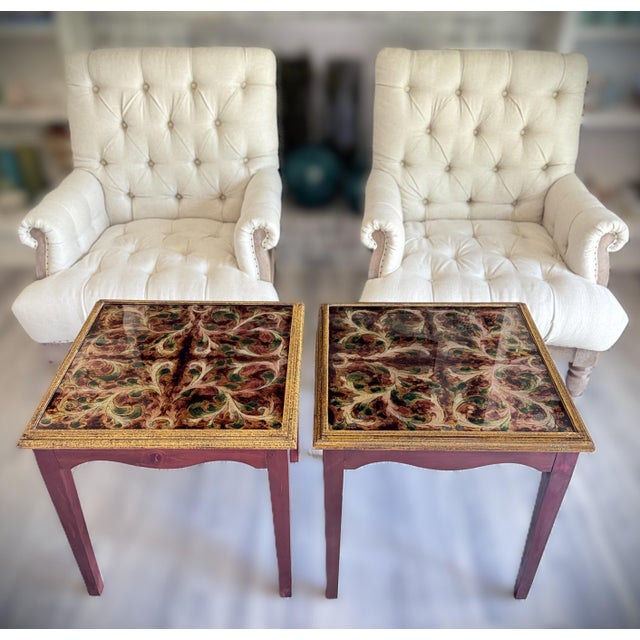 This striking pair of handcrafted Peruvian end tables features reverse-painted glass tops in a rich palette of amber,...