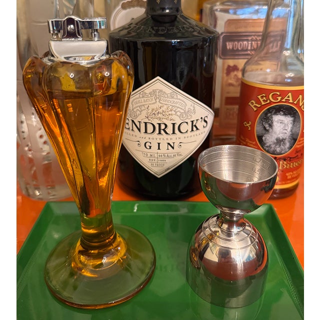 What a rare and striking mid-century modern table lighter! Rich amber glass, gorgeous, sculptural fluted form and a...