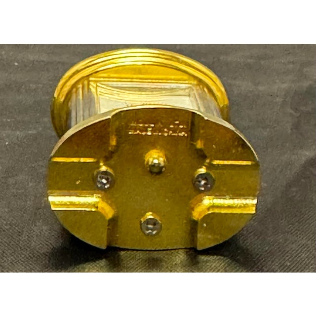 The VTG MOULIN LTD Miniature Brass Carriage Clock is a charming and elegant collectible piece perfect for any mantel or...