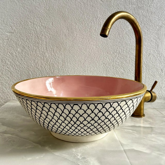 Luxury 14-Inch Round Handcrafted Pink & White Ceramic Sink with 14K Gold Rim Enhance the elegance of your bathroom with...