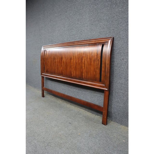Contemporary king-size headboard in mahogany with a rich reddish-brown finish and figured wood grain. The rectangular...