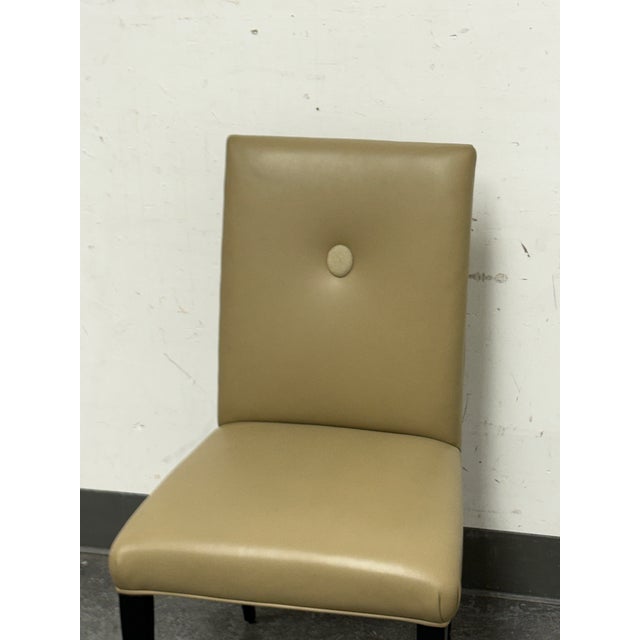 Design Plus Gallery presents the Axis Leather Side Chair from Swaim. This upholstered chair pairs a gently curved high...
