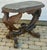 Incredible heavily carved walnut table. Two spread wing eagles perched on scrolled base with four feet. Black marble top....