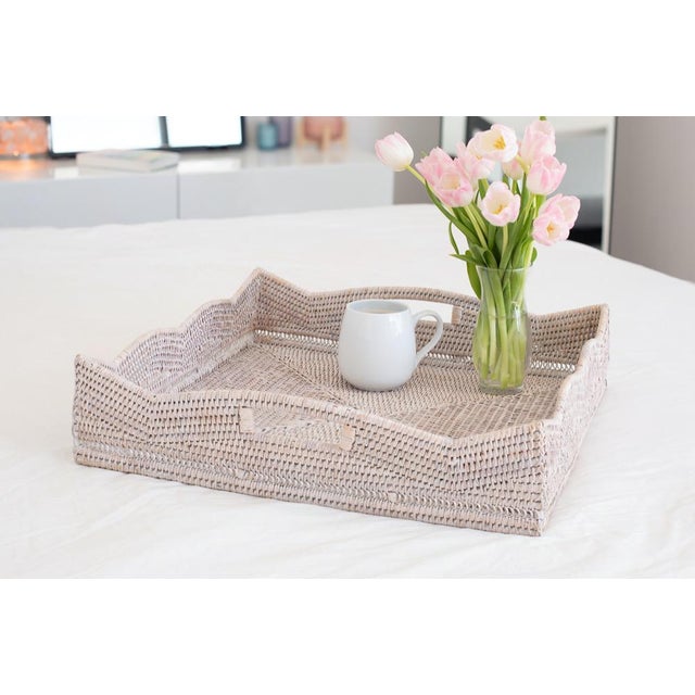Our Scallop Collection rattan storage baskets, serving trays, and ottoman trays will instantly add a gorgeous touch to any...