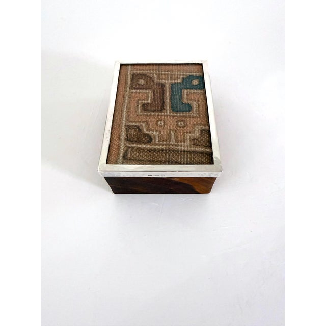 Peruvian hardwood box with pre-Columbian textile mounted under a glass frame and secured with a hammered sterling silver...