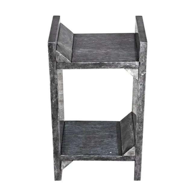 Contemporary, edgy, and quite simply exceptional, this side table is handcrafted of minimally finished marble, it features...