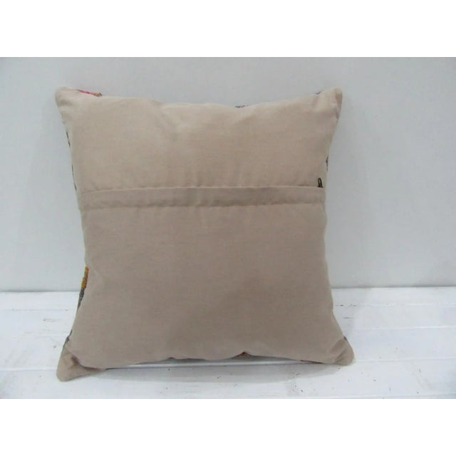 This is a pillow cover made from a vintage kilim rug. The piece was properly washed and ready to use. Pillow inserts not...