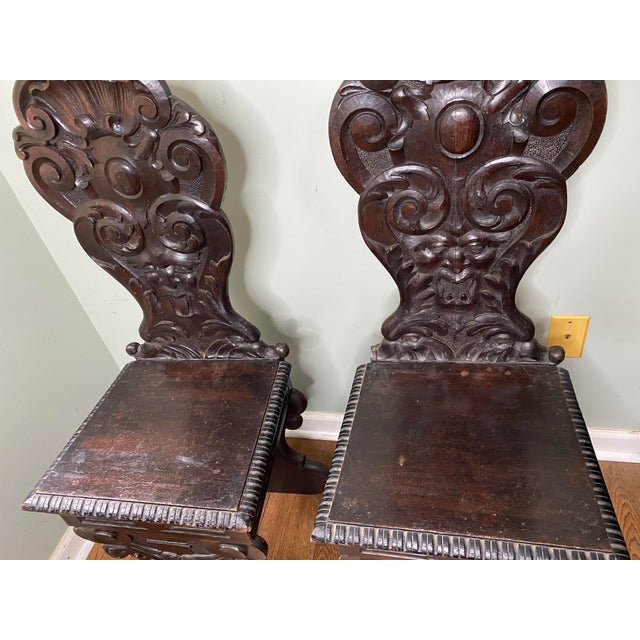 Offered is a striking matched pair of authentic 19th-century Italian Renaissance Revival (Mannerist style) Sgabelli hall...