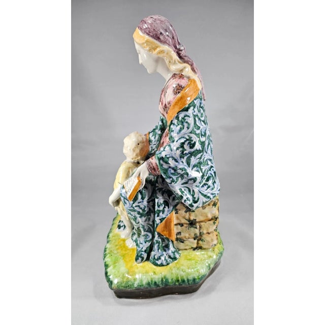 This faience figural group was produced in Bologna, Italy by Aurelio Minghetti in the early 1900s. This piece was sold by...