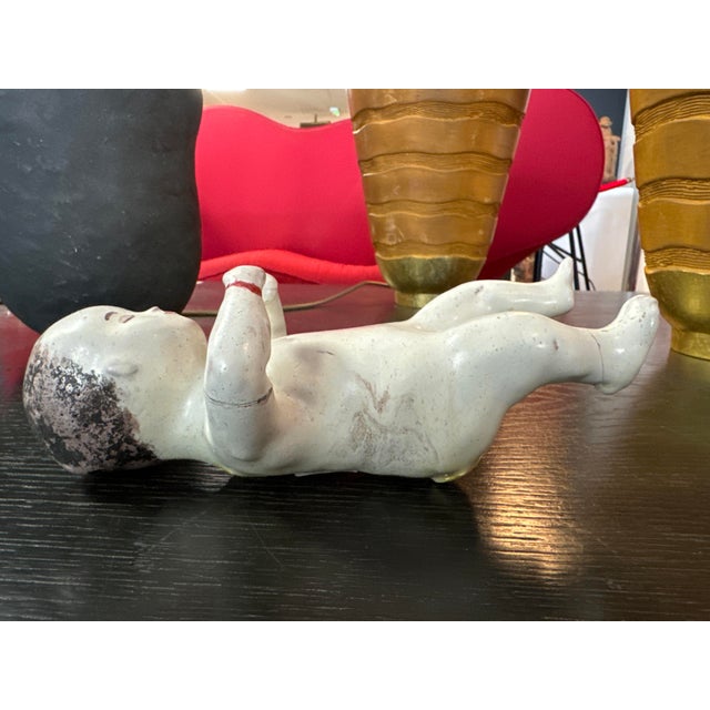 Old accidents repaired a long time ago, including a wrist repaired with red wax. Very rare collector's item I have...