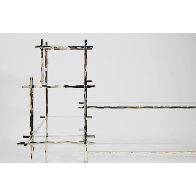 Geometric Fluide Book Case by Jennifer Midoz Dimensions: Custom dimensions Materials: White nickel polished brass. The...