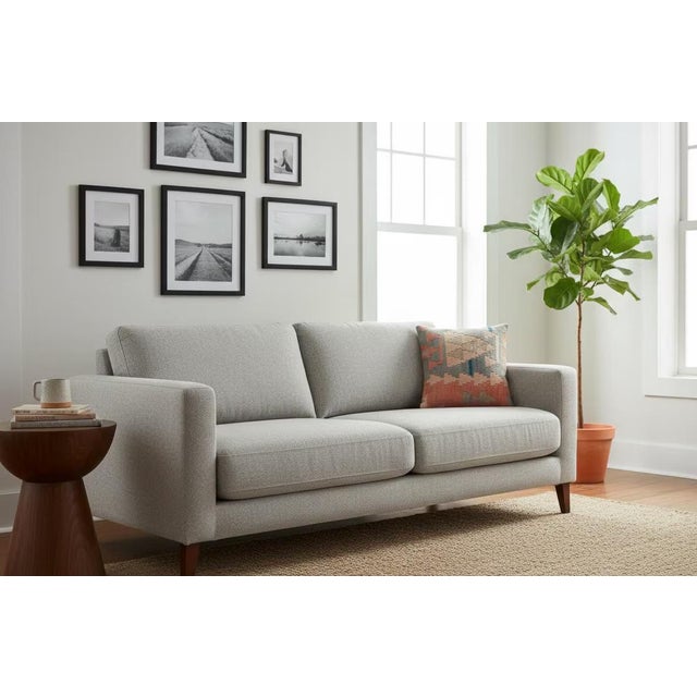 This beautifully faded 16x16 pillow cover is made from an authentic vintage kilim, showcasing soft peach, muted grey-blue,...