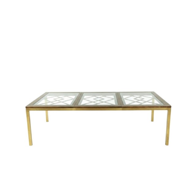 A rare massive vintage brass and glass fretwork extension dining room table. This is such a wonderful rare vintage piece...