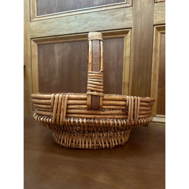 A very nice unique footed basket hand woven. This basket originally used for gathering works well for your farmers market...
