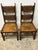 A handsome pair of antique English oak chairs, distinguished by their exceptional colour and surface, the wood having...