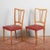 This pair of chairs dating back to the mid-twentieth century is a vibrant example of modernism, distinguished by the...
