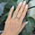 A captivating watermelon tourmaline glows with vibrant pink and green hues, accented by natural diamonds for added...
