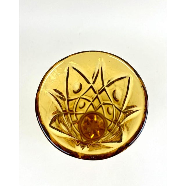 Delicate 20th century glass vase from the Art Deco period around 1920 in Austria. This lovely amber colored glass vase...