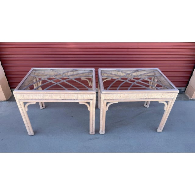 Vintage pair of Whitewash Bamboo/Rattan Glass Top Side Tables. Has a peach beige tone. Pattern on top with glass top....
