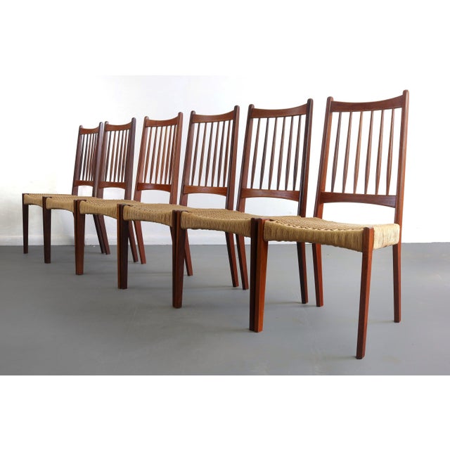 Danish Modern Teak Spindle Back Dining Chairs with Paper Cord, Set of 6 A fantastic set of 6 model teak dining chairs....