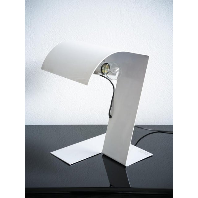 Blitz lamp by Trabuccho, Vecchi and Volpi for Stilnovo,1970s. Stunning sculptural table lamp created by a single folded...