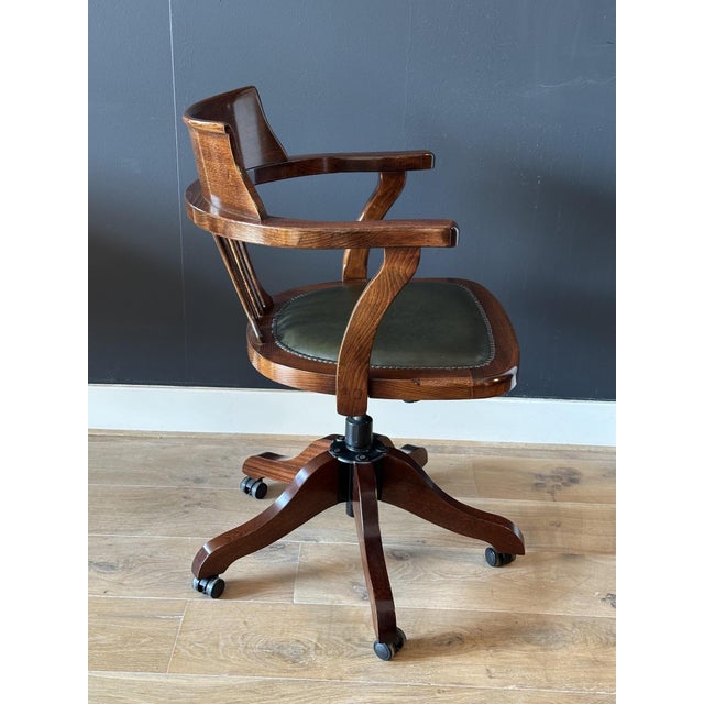Classic mahogany desk chair with a green leather seat. Beautiful appearance and comfortable chair for daily use. The chair...