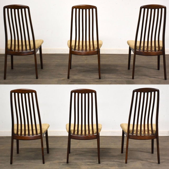 A set of six mid century modern rosewood color dining chairs with beige tweed original fabric by Preben Schou. Seat height...