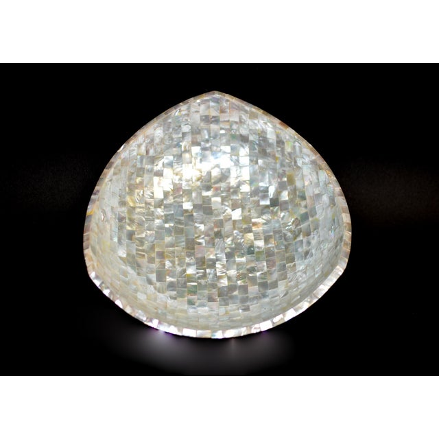 Embodying luxury, artistry and utility, this exquisite mother of pearl bowl is made with meticulous care to detail....