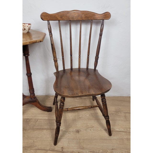 This is a beautiful kitchen chair, dating to the early 20th Century, with defining vintage features that are sure to...