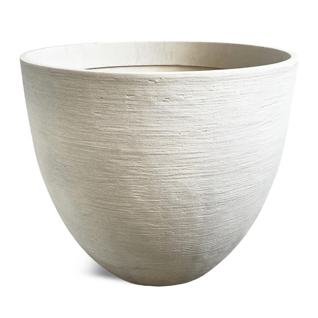 Modern outdoor planter with the look of modern cement without the weight. Easy to use and move light weight resin...