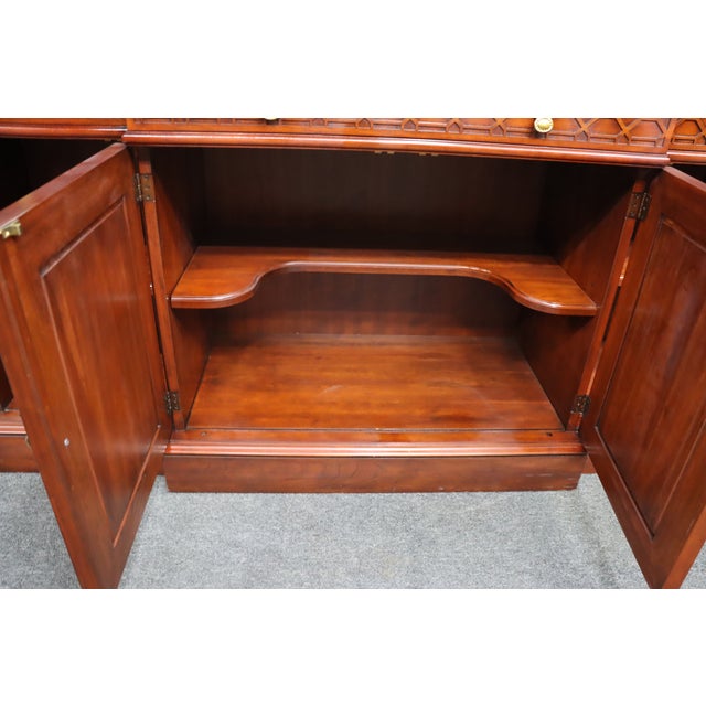 Crafted by renowned Virginia furniture maker Henkel Harris, this stately breakfront china cabinet is constructed from...