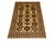 This Kazak style wool rug has a warm cream field filled with repeated tribal medallions in rust, navy, and brown. Smaller...