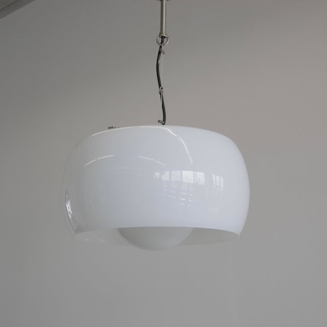 Hanging lamp designed by vico magistretti. Italy, artemide, 1962. the omega lamp comprising of two separate pieces of...