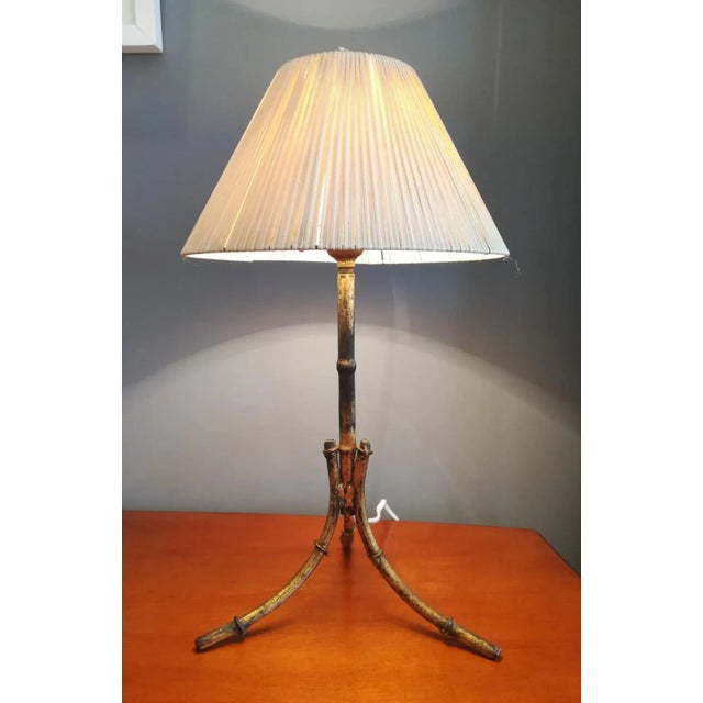 Table lamp in gilded metal imitating bamboo. Made in Spain in the style of the famous French firms of the time. The...
