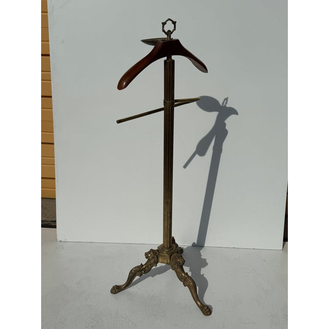 Rococo style brass gentleman’s valet / coat hanger in the style of Maison Jansen with lion head legs.