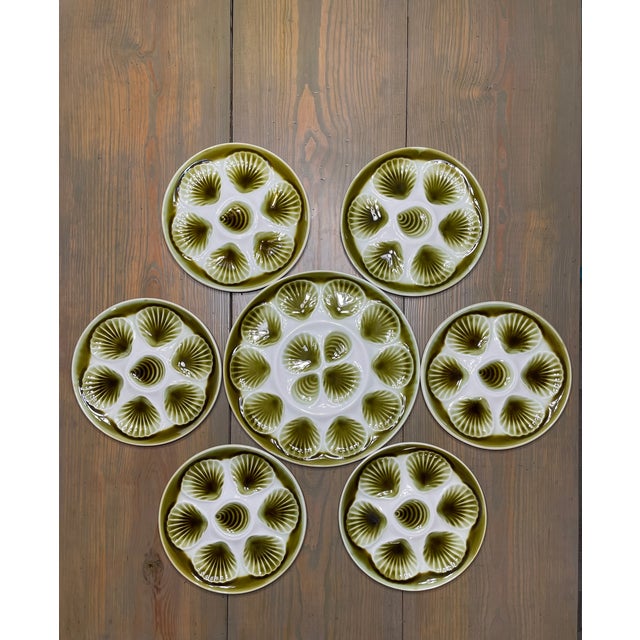 A beautiful set of seven Mid Century French faience glazed Majolica Oyster Plates with Platter, circa 1950s-60s. Made in...