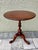 Small round top wood table that can be used as a wine table, plant stand, or occasional table. Appears to be made out of...