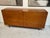 A stunning vintage walnut dresser . This piece embodies mid-century modern elegance and functionality with its 8 spacious...