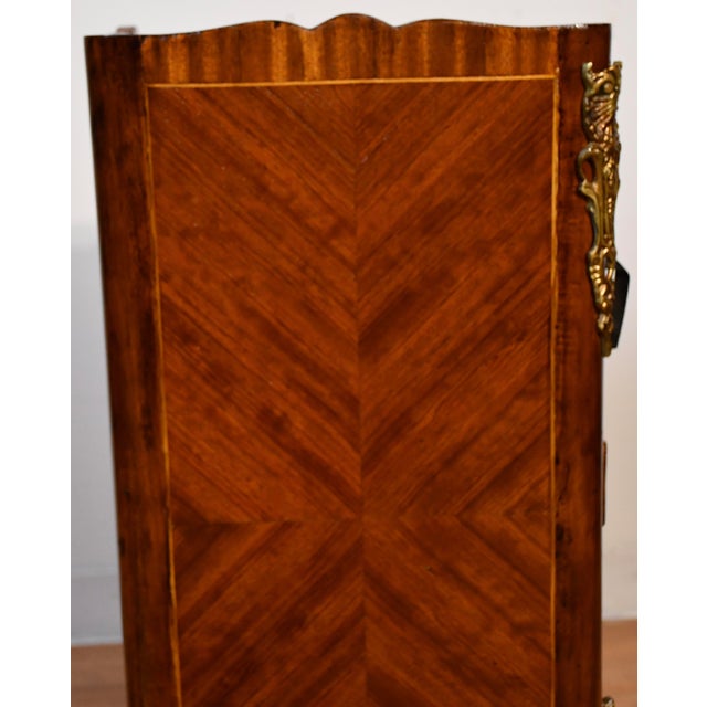 Description: Elegant antique French Louis XV style nightstand, finely crafted in rich mahogany with beautiful inlaid...