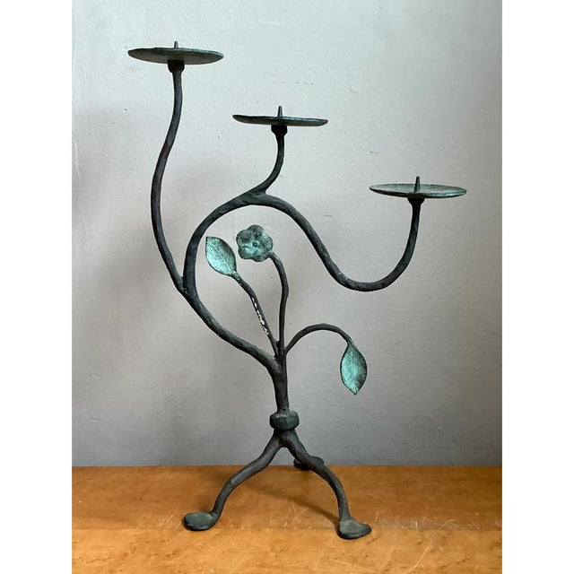 This vintage three-arm candelabrum is a striking example of mid-20th-century organic metalwork, hand-forged to evoke the...