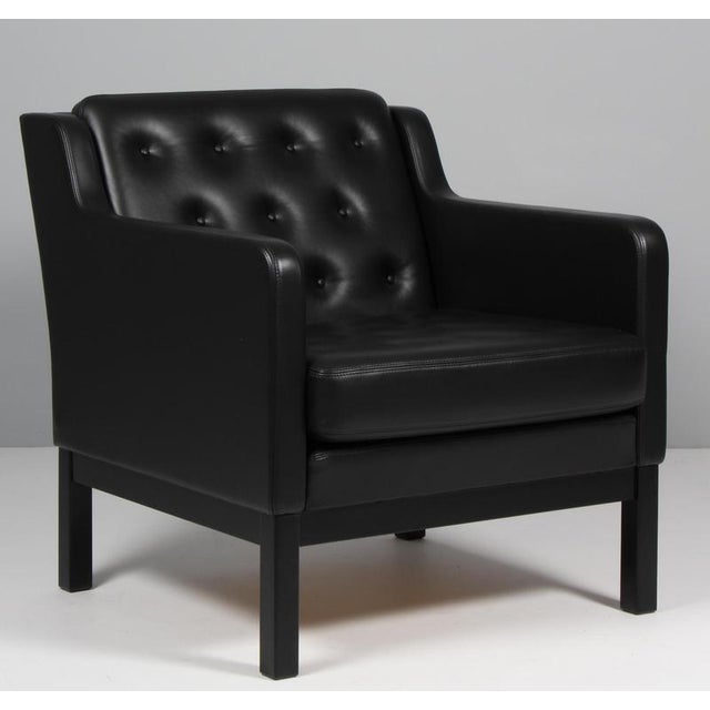 Erik Jørgensen lounge chair new upholstered with black aniline leather. Frame of black painted beech. Model EJ 315/1, made...