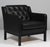 Erik Jørgensen lounge chair new upholstered with black aniline leather. Frame of black painted beech. Model EJ 315/1, made...