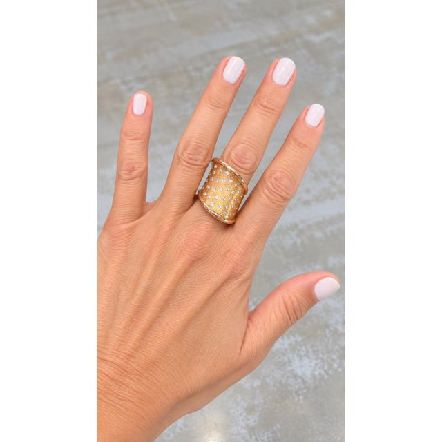 A bold and beautifully sculpted statement ring by renowned Italian jeweler Leo Pizzo, crafted in rich 18K rose gold and...