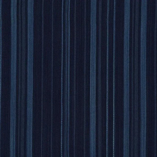Color-drenched yarns are twisted and woven together resulting in striated irregular stripes that feel artisanal and...