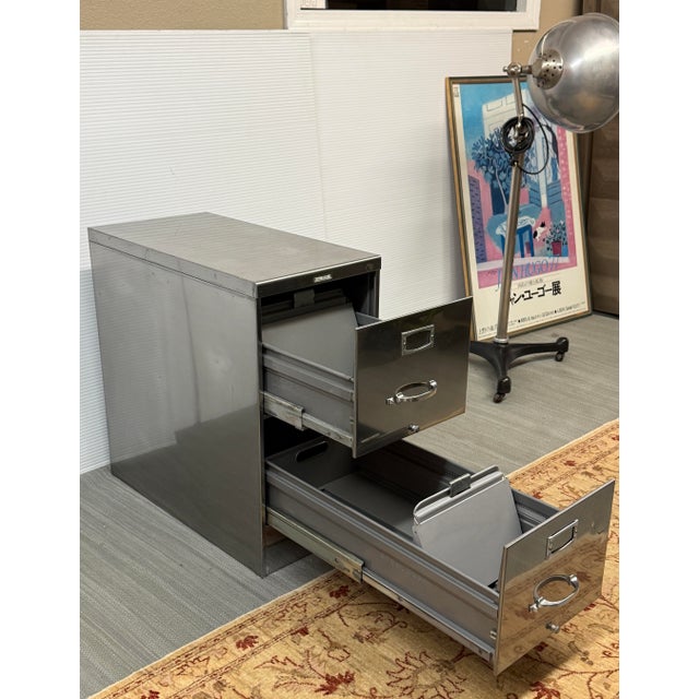 Design Plus Gallery presents a Two Drawer File Cabinet. Constructed in polished steel, this streamlined cabinet showcases...