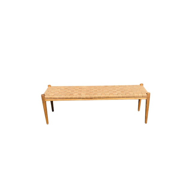 A hand-crafted teak framed & woven leather strap bench. These benches are crafted by local artisans using a wood joinery...