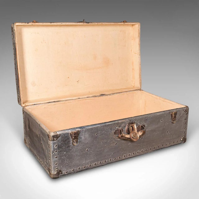 This is a large antique shipping chest. A Continental, aluminium travelling trunk, dating to the Edwardian period, circa...