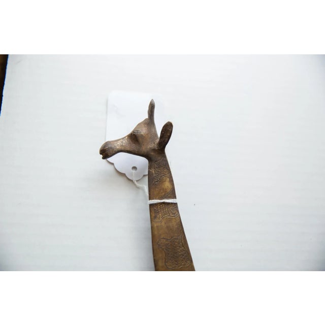 :: Vintage handmade African bronze alloy giraffe. Made approximately 40-70 years ago, each figure in this collection...